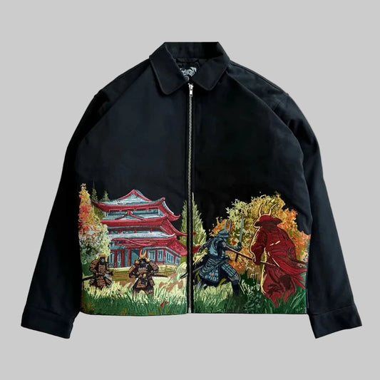 Black jacket with artistic designs of samurai and a temple on a gray background, featuring branding.