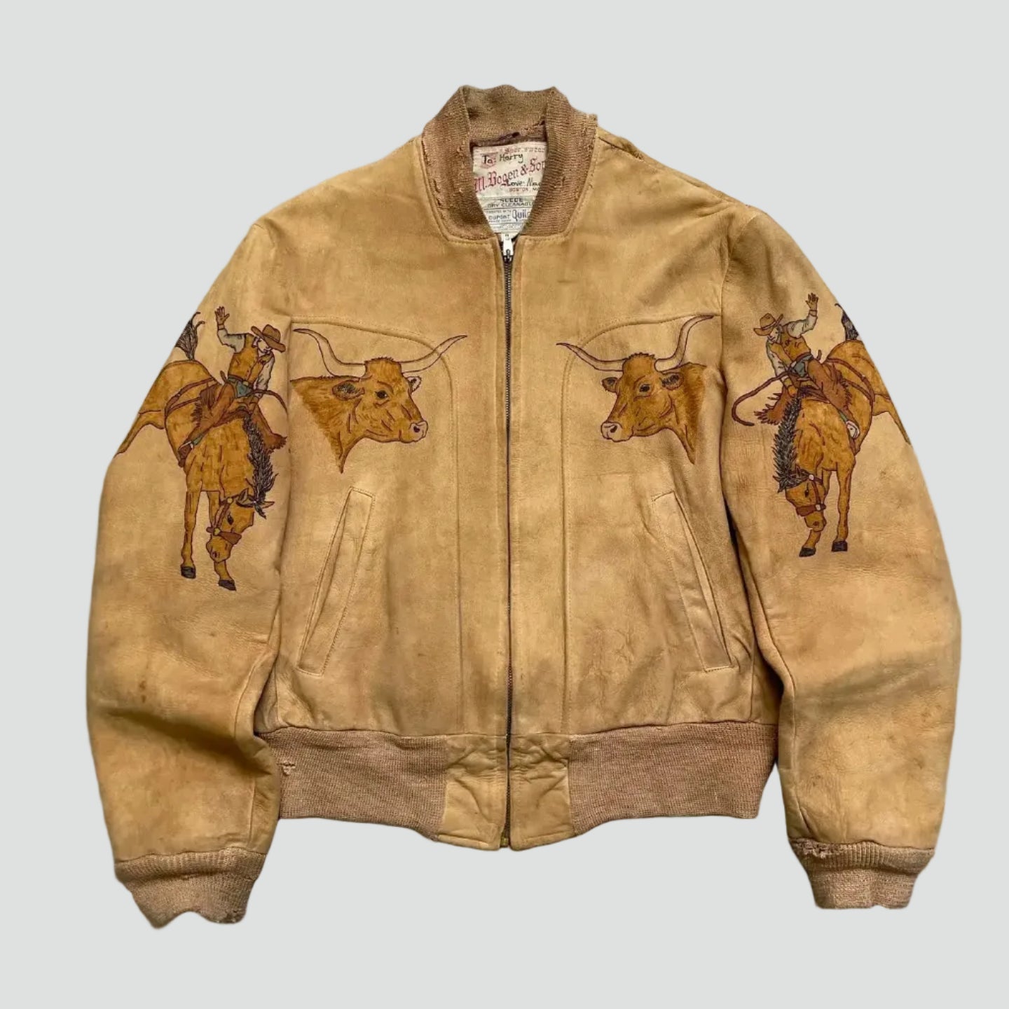 Brown jacket with bull embroidery on a textured gray surface